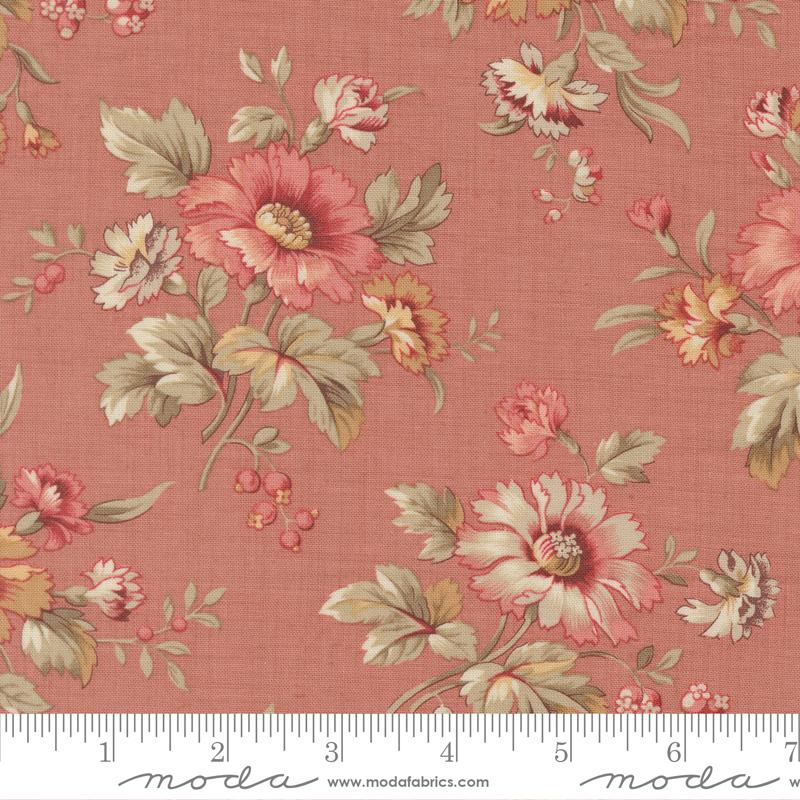 Floral fabric pattern with a ruler at the bottom for scale, on a pink background.