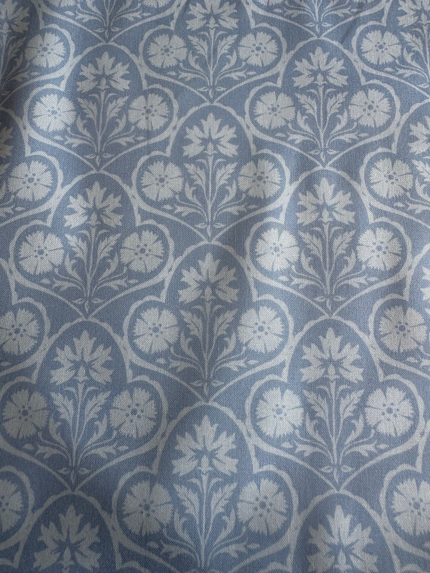 Blue fabric with white floral pattern