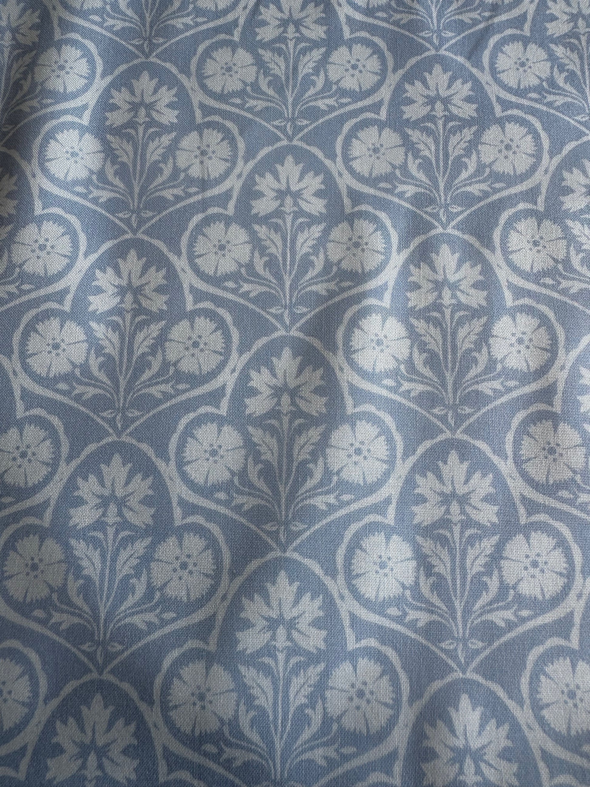 Blue fabric with white floral pattern