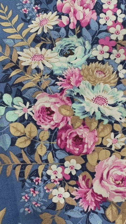Tilda Fabric Chic Escape Whimsyflower Navy Blue - 100% Cotton fabric showing chintz like pink and teal flowers and leaves on a blue  background. Free delivery over £30