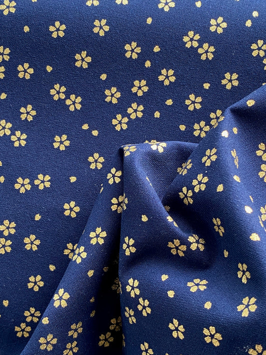 Sevenberry Yakata Metallic Flower Navy Cotton Fabric.  It is ideal for patchwork, quilting, patchwork, dressmaking and other crafts. Free delivery from Rosemary Wild over £30.